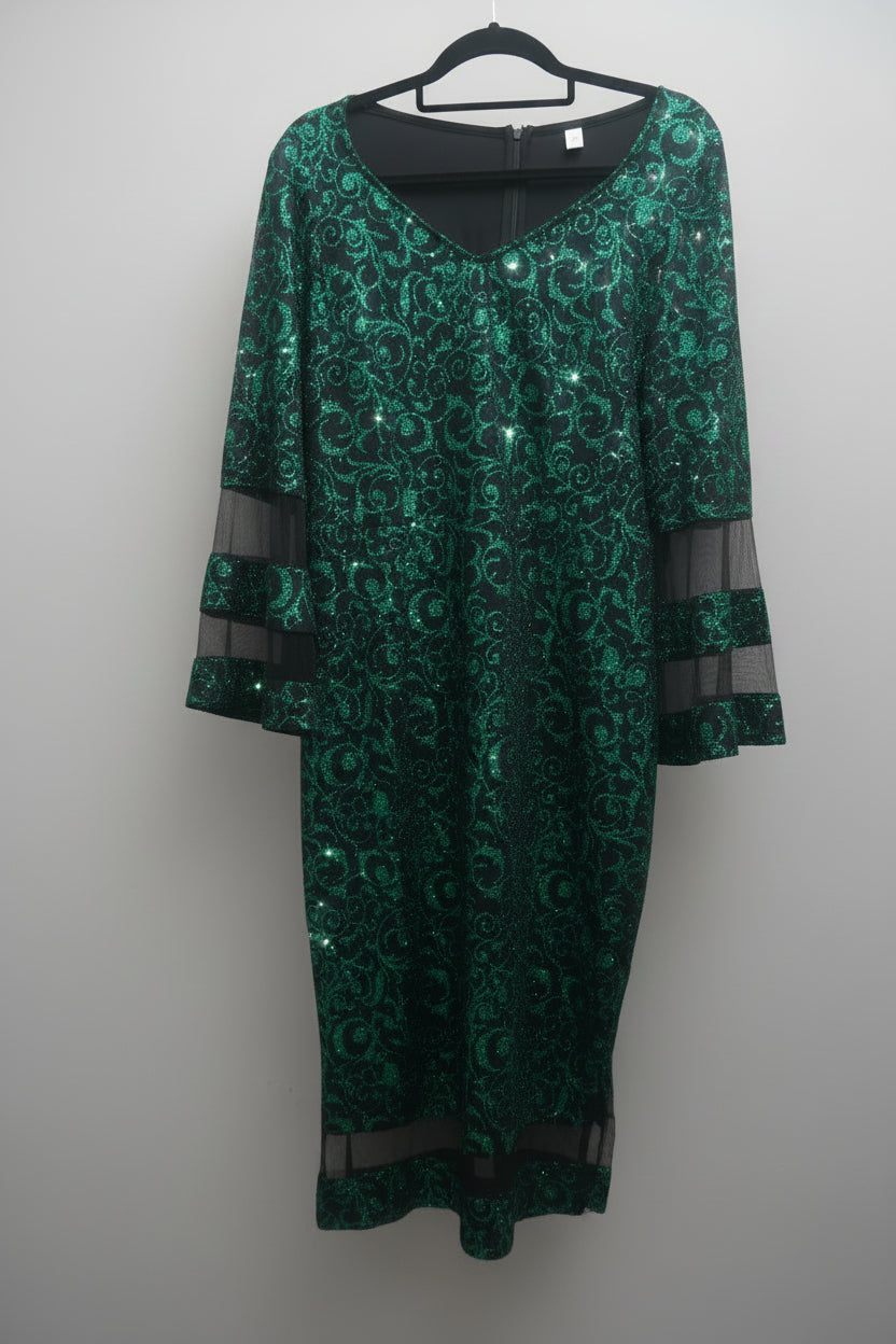 Full view of candy apple green glitter holiday dress with black sheer bell sleeves on hanger